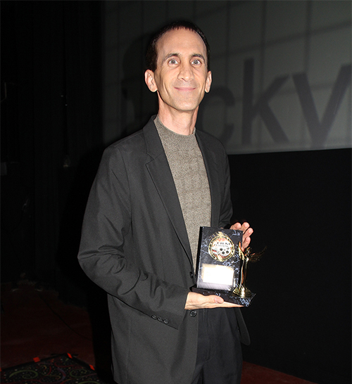 Photo of Gregory Blair & award at the Lucky Strike Film Festival
